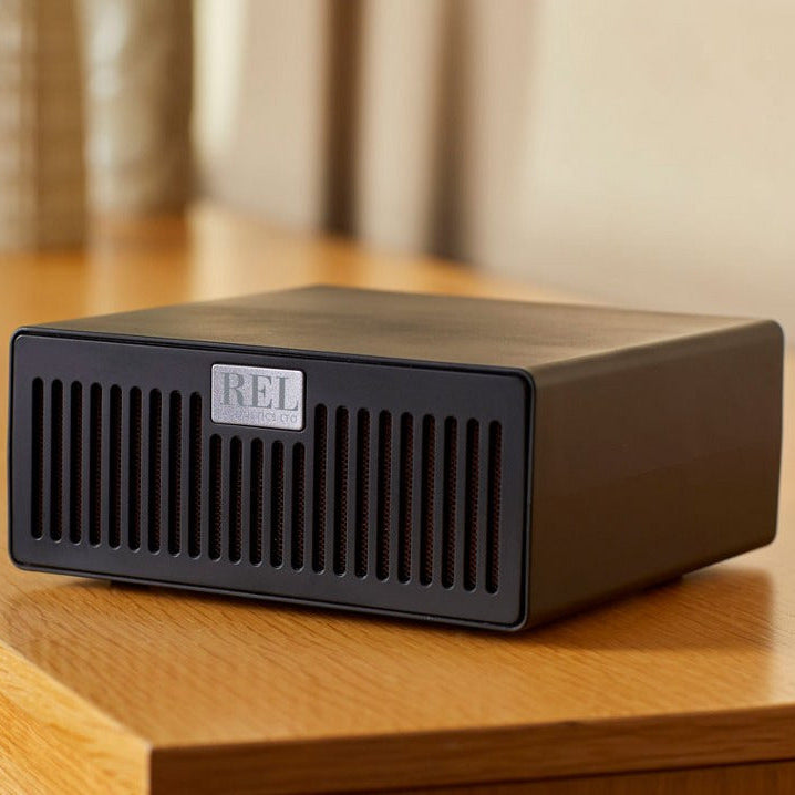 REL airship transmitter for 212/sx on a wooden surface