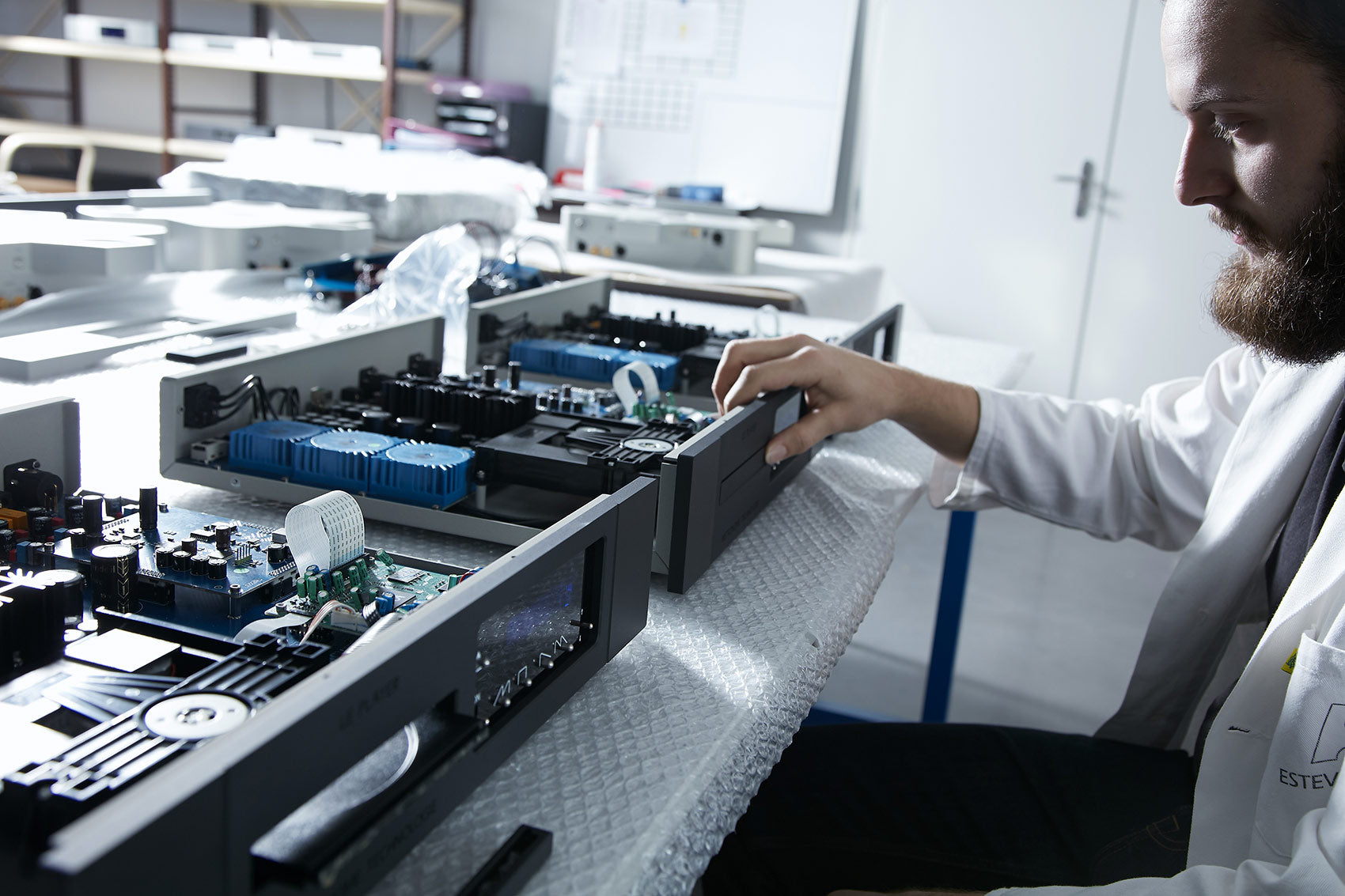 Metronome person working on electronic equipment in a laboratory setting