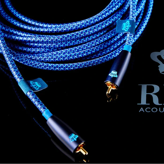 Blue REL commodore .1/lfe subwoofer cable with gold connectors on a black background featuring REL Acoustics Ltd logo.