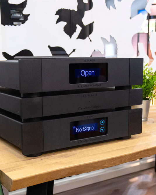 Stack Metronome Gamme Classica with digital displays on a wooden surface