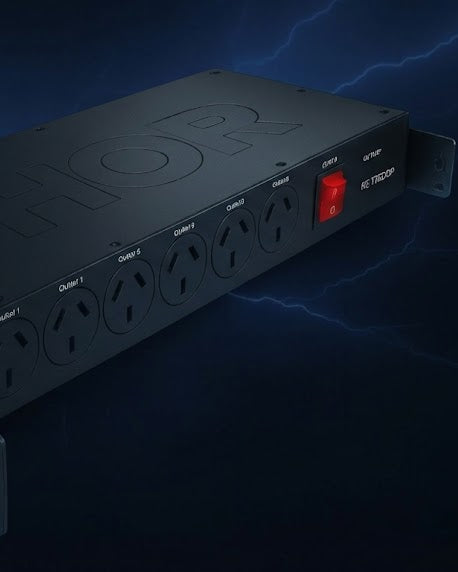 Thor Power strip with multiple outlets and a red switch on a dark background